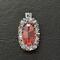 Orange oval-shaped crystal is approx. 25mm x 16mm surrounded by Swarovski Elements Crystals and seed beads. 